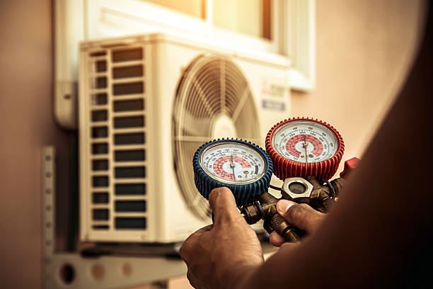 Professional Air Conditioning Service technician working in Dora, AL